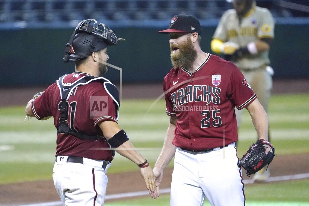 Rick Scuteri Arizona Diamondbacks pitcher Archie Bradley, right, and Stephen Vogt, left, celebrate after defeating the San Diego Padres in a baseball game, Sunday, Aug 16, 2020, in Phoenix. (AP Photo/Rick Scuteri)
