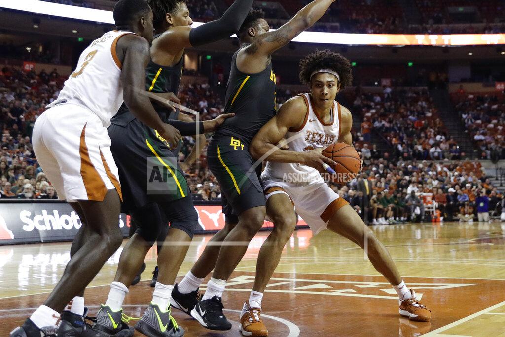 Eric Gay Texas forward Jericho Sims, right, is pressured by Baylor guard Mark Vital, second from right, and forward Freddie Gillespie, second from left, during the second half of an NCAA college basketball game, Monday, Feb. 10, 2020, in Austin, Texas. (AP Photo/Eric Gay)