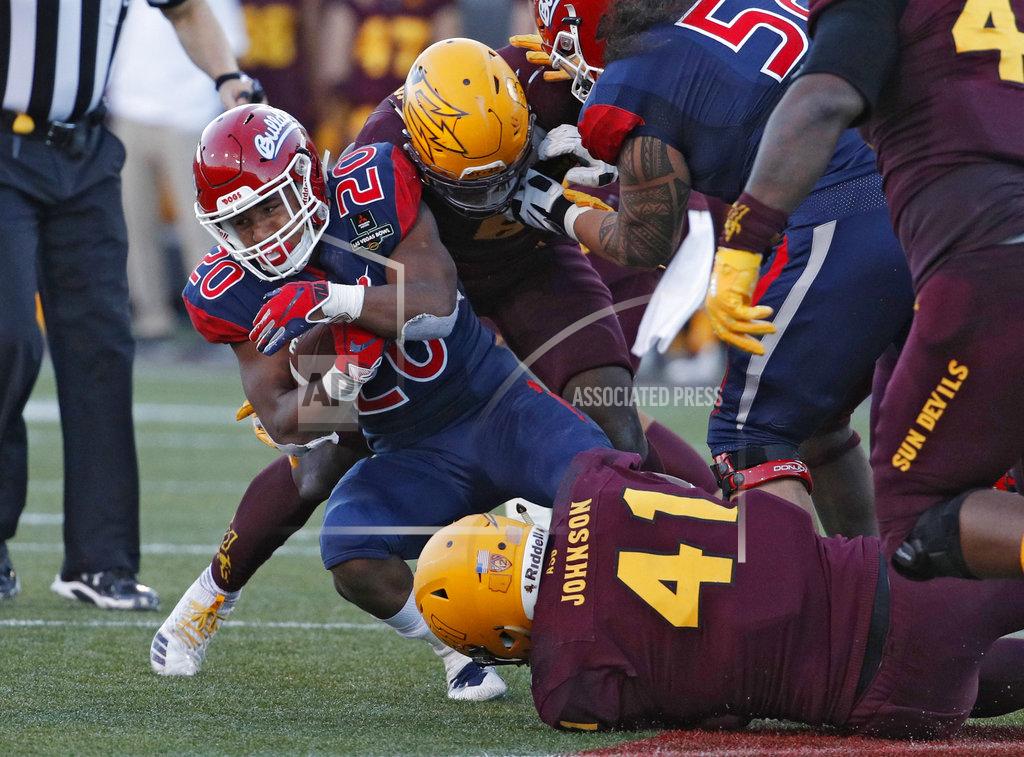 John Locher Fresno State running back Ronnie Rivers (20) is tackled after running for a gain against Arizona State during the second half of the Las Vegas Bowl NCAA college football game, Saturday, Dec. 15, 2018, in Las Vegas. (AP Photo/John Locher)