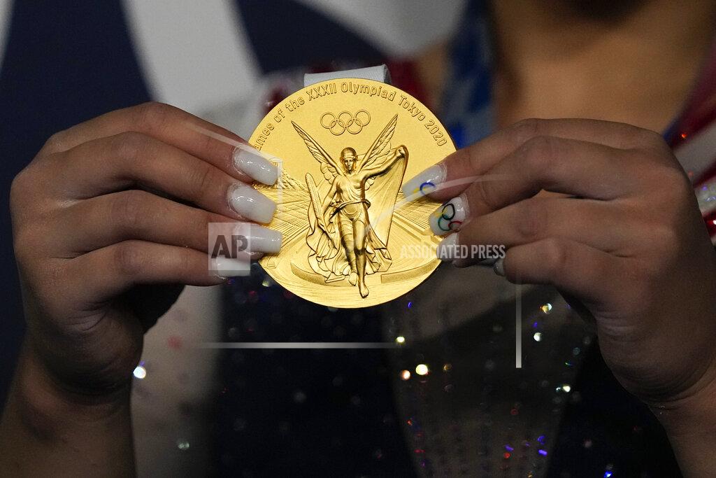 Gregory Bull Sunisa Lee, of United States, poses for a picture after winning the gold medal in the artistic gymnastics women's all-around final at the 2020 Summer Olympics, Thursday, July 29, 2021, in Tokyo, Japan. (AP Photo/Gregory Bull)