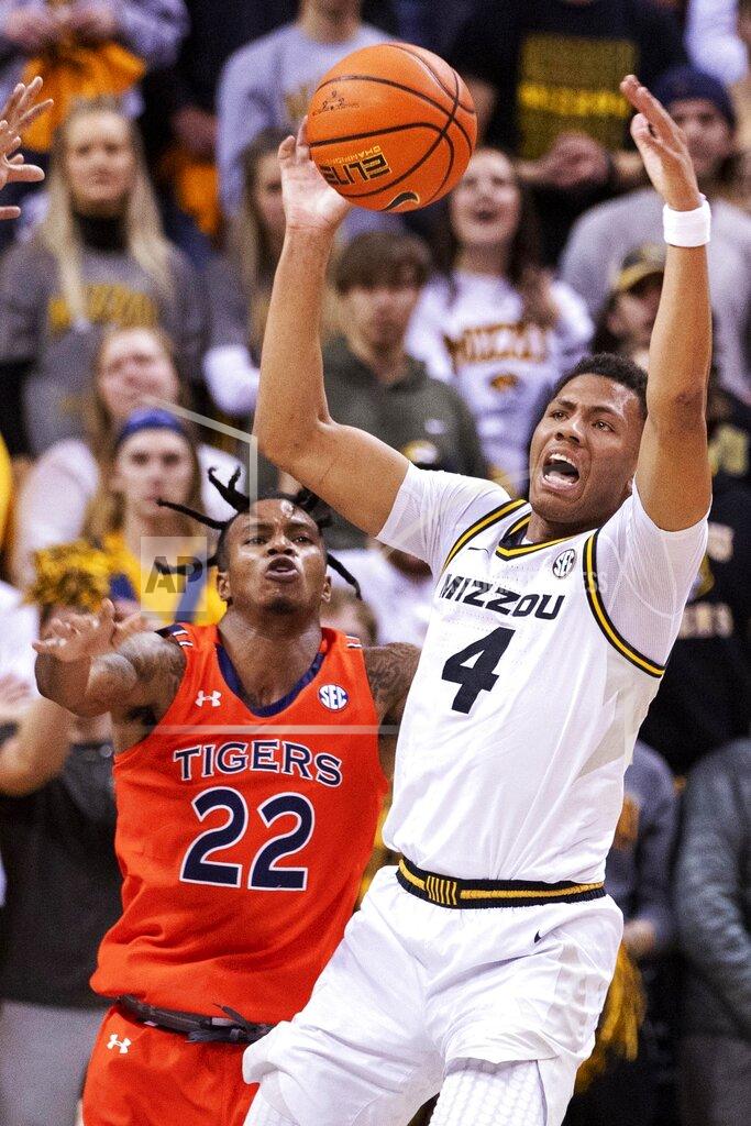 L.g. Patterson Missouri's Javon Pickett, right, grabs a rebound in front of Auburn's Allen Flanigan, left, during the first half of an NCAA college basketball game Tuesday, Jan. 25, 2022, in Columbia, Mo. (AP Photo/L.G. Patterson)