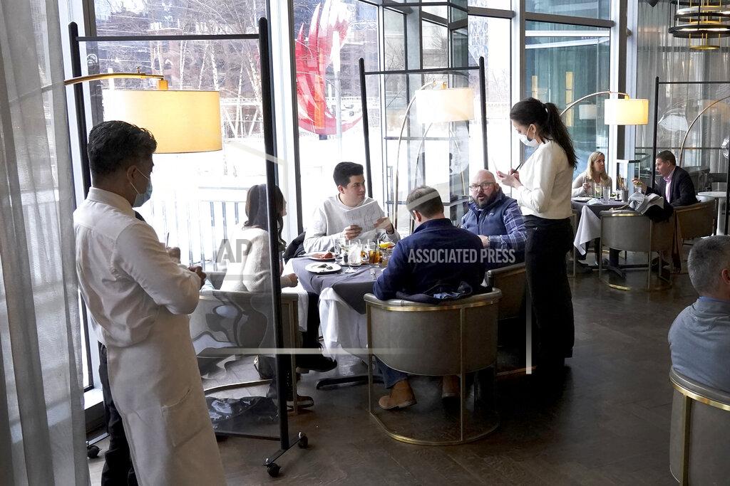 Charles Rex Arbogast FILE - In this Jan. 27, 2021 file photo, patrons enjoy lunch indoors at Gibsons Italia restaurant in Chicago. A recent spike in coronavirus cases in some states has led one of the nation's top health experts to suggest that governors could “close things down” like they did during previous surges. But that doesn't appear likely to happen — not even in states led by Democratic governors who favored greater restrictions in the past. (AP Photo/Charles Rex Arbogast, File)