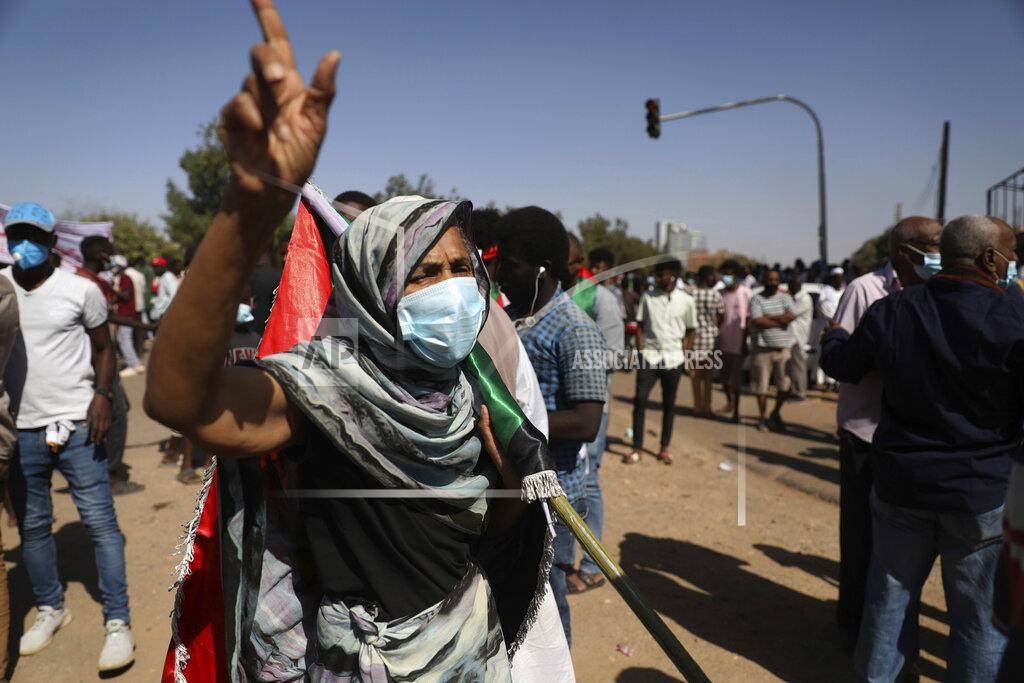 Protesters gather in Khartoum, Sudan, Saturday, Dec. 19, 2020. Protests in Sudan’s capital and across the country are demanding a faster pace to democratic reforms, in demonstrations that are marking the two-year anniversary of the uprising that led to the military’s ouster of strongman Omar al-Bashir. (AP Photo/Marwan Ali)