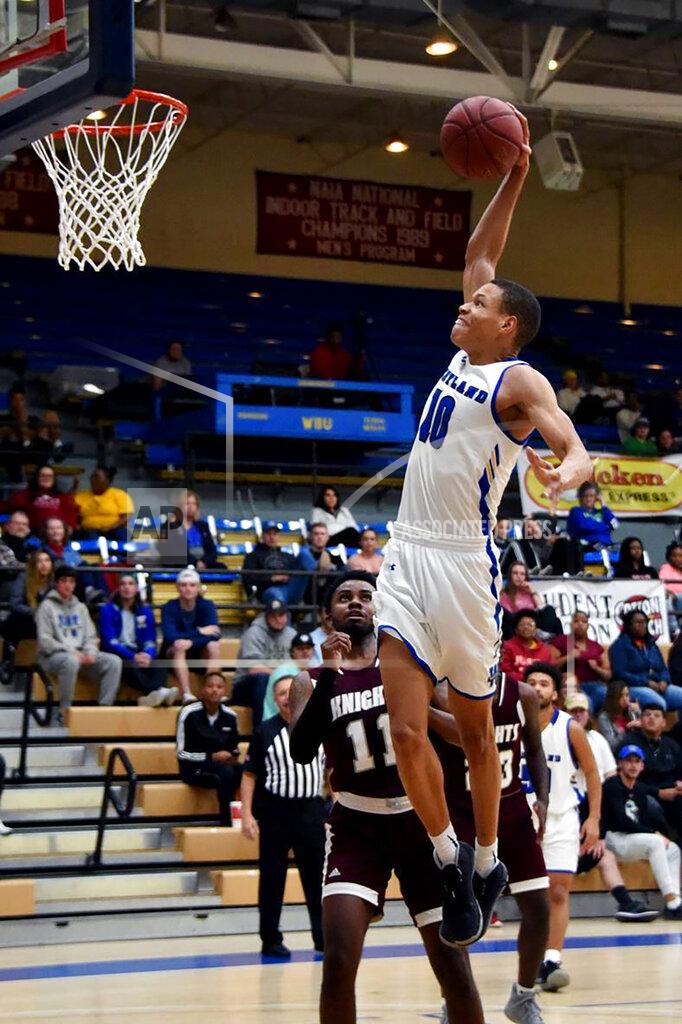 Claudia Lusk In this photo provided by Wayland Baptist University, Wayland Baptist guard J.J. Culver (10) shoots during an NAIA college basketball game against Southwestern Adventist, Tuesday, Dec. 10, 2019, in Plainview, Texas. Culver became the fourth college basketball player to score 100 or more points in a game, reaching the century mark in a 124-60 win over Southwestern Adventist on Tuesday night. (Claudia Lusk/Wayland Baptist University via AP)