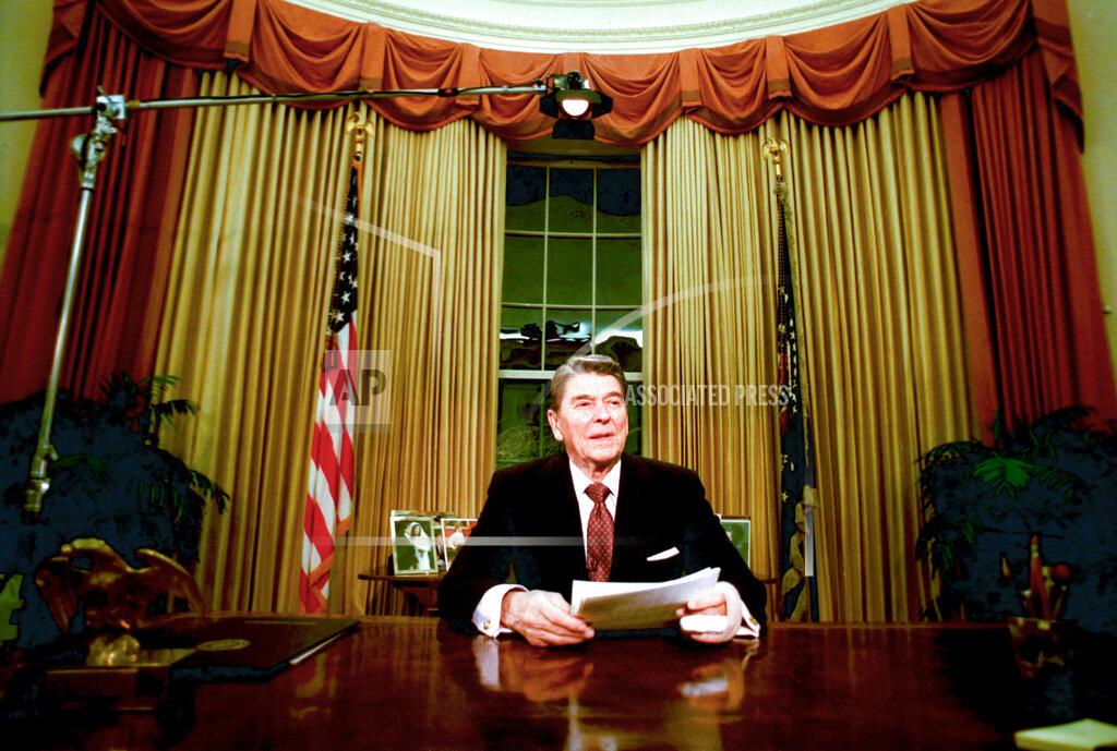 Ron Edmonds FILE - In this Jan. 11, 1989, file photo departing President Ronald Reagan sits in the Oval Office after he delivered his farewell address to the nation in the White House in Washington, on Wednesday, Jan. 11, 1989. (AP Photo/Ron Edmonds, File)