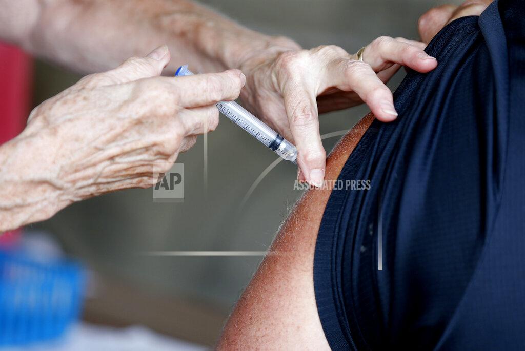 Nathan Papes A man receives a COVID-19 vaccine at a clinic at Mother's Brewing Company in Springfield, Mo., on Tuesday, June 22, 2021. As the U.S. emerges from the COVID-19 crisis, Missouri is becoming a cautionary tale for the rest of the country: It is seeing an alarming rise in cases because of a combination of the fast-spreading delta variant and stubborn resistance among many people to getting vaccinated. (Nathan Papes/The Springfield News-Leader via AP)