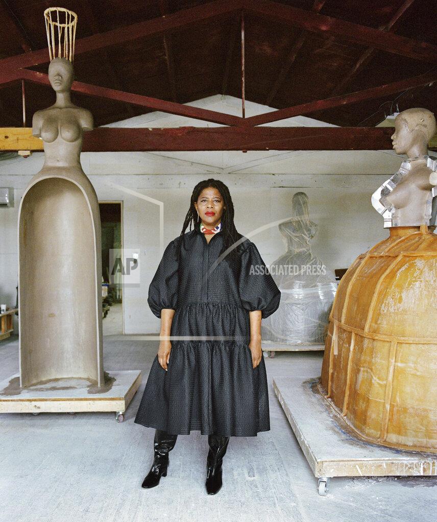 In this 2020 photo provided by Boston's Institute of Contemporary Art, artist Simone Leigh poses for a photo at Stratton Sculpture Studios in Philadelphia. Leigh will be the first Black woman ever to represent the U.S. at Italy's prestigious Venice Biennale arts festival to be held in 2022. (Shaniqwa Jarvis/Simone Leigh and Hauser & Wirth via AP)