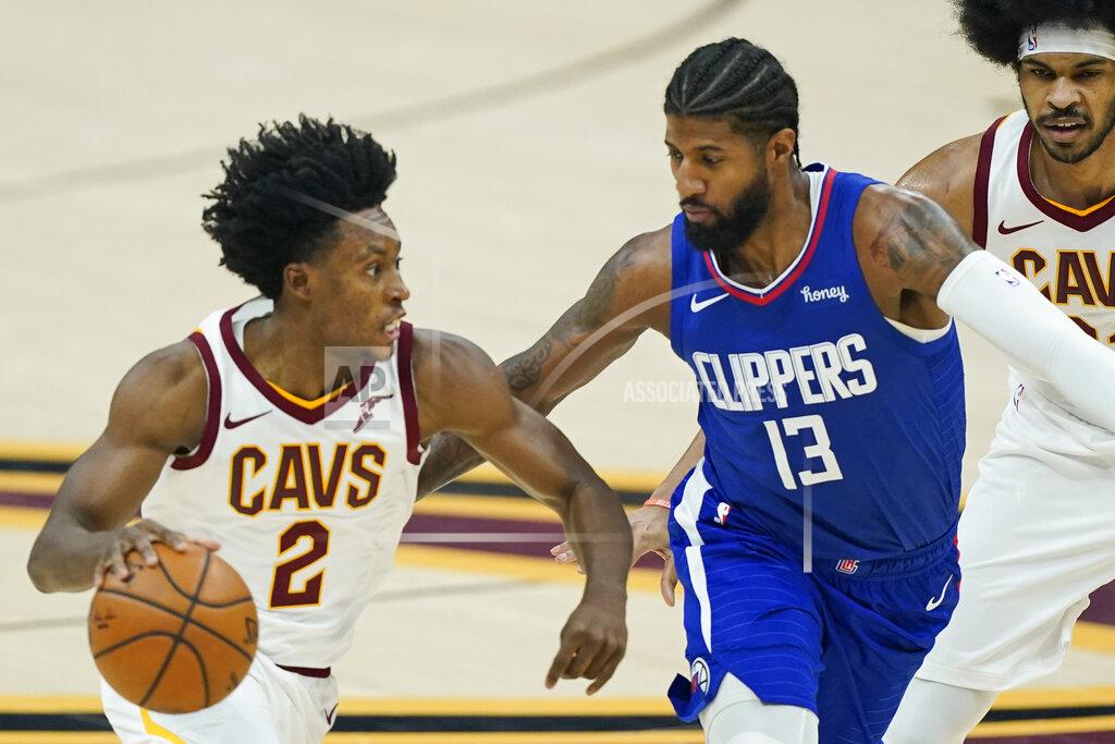 Tony Dejak Cleveland Cavaliers' Collin Sexton (2) drives against Los Angeles Clippers' Paul George (13) during the first half of an NBA basketball game Wednesday, Feb. 3, 2021, in Cleveland. (AP Photo/Tony Dejak)