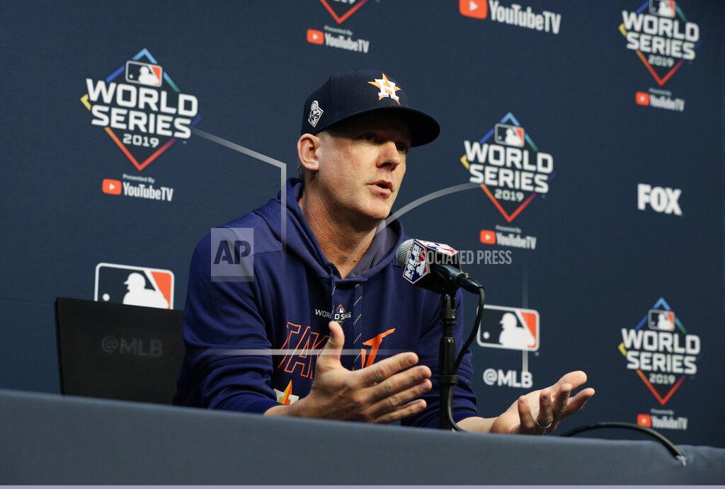 Eric Gay FILE - In this Oct. 28, 2019, file photo, Houston Astros manager AJ Hinch talks to the media during a news conference for baseball's World Series, in Houston. Houston manager AJ Hinch and general manager Jeff Luhnow were suspended for the entire season Monday, Jan. 13, 2020, and the team was fined $5 million for sign-stealing by the team in 2017 and 2018 season. Commissioner Rob Manfred announced the discipline and strongly hinted that current Boston manager Alex Cora — the Astros bench coach in 2017 — will face punishment later. Manfred said Cora developed the sign-stealing system used by the Astros. (AP Photo/Eric Gay, File)