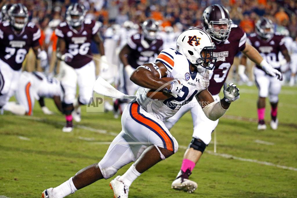 Rogelio V. Solis Auburn quarterback Cord Sandberg (24) sprints past Mississippi State defenders during the second half of an NCAA college football game in Starkville, Miss., Saturday, Oct. 6, 2018. Mississippi State won 23-9. (AP Photo/Rogelio V. Solis)