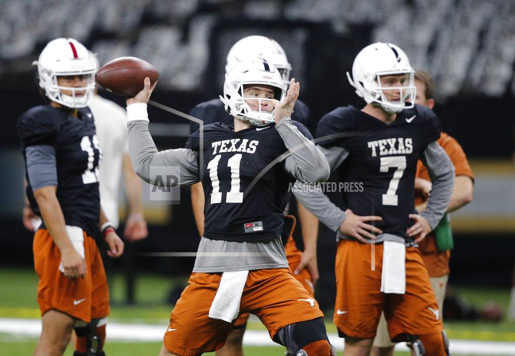 Gerald Herbert Texas quarterback Sam Ehlinger (11) throws during practice at the Superdome in New Orleans, Friday, Dec. 28, 2018. Texas will face Georgia in the Sugar Bowl NCAA college football game on Jan. 1, 2019. (AP Photo/Gerald Herbert)