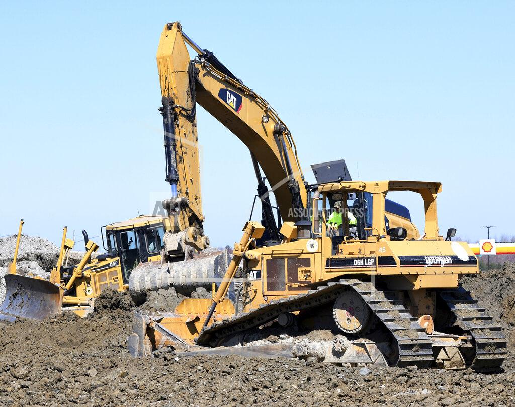 Warren Dillaway Bull dozers work at the southern end of the Truck World construction site near the intersection of Route 7 and Interstate 90 in Conneaut, Ohio on Thursday April 2, 2020. (Warren Dillaway/The Star-Beacon via AP)
