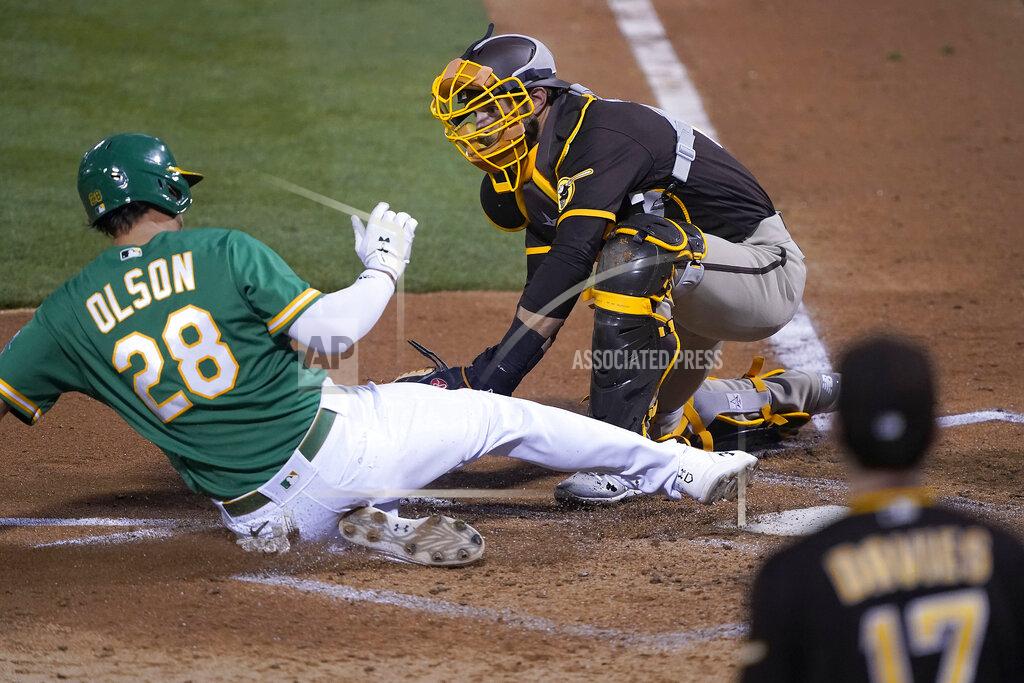 Tony Avelar San Diego Padres catcher Austin Nola (22) tags out Oakland Athletics' Matt Olson (28) at home plate during the fourth inning of a baseball game in Oakland, Calif., Friday, Sept. 4, 2020. (AP Photo/Tony Avelar)