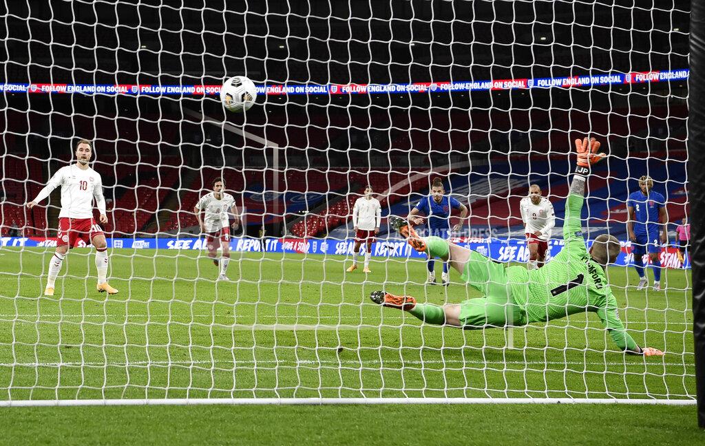 Daniel Leal-Olivas Denmark's Christian Eriksen, left, scores his team's first goal from the penalty spot during the UEFA Nations League soccer match between England and Denmark at Wembley Stadium in London, England, Wednesday, Oct. 14, 2020. (Daniel Leal-Olivas/Pool via AP)