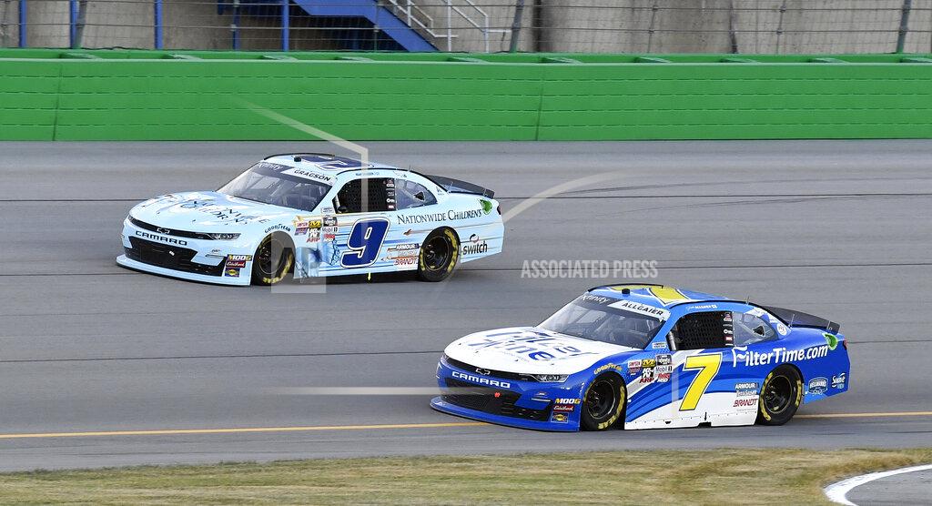 Timothy D. Easley Justin Allgaier (7) battles Noah Gragson (9) for position during the NASCAR Xfinity Series auto race at Kentucky Speedway in Sparta, Ky., Friday, July 12, 2019. (AP Photo/Timothy D. Easley)