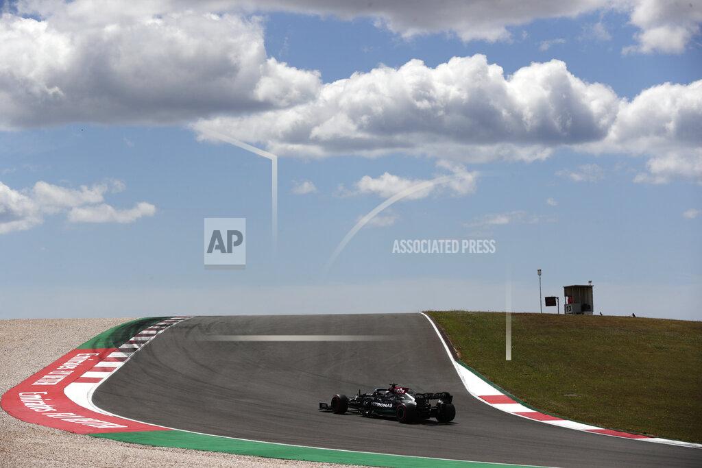 Manu Fernandez Mercedes driver Lewis Hamilton of Britain steers his car during the first free practice session ahead of the Portugal Formula One Grand Prix at the Algarve International Circuit near Portimao, Portugal, Friday, April 30, 2021. The Portugal Grand Prix will be held on Sunday. (AP Photo/Manu Fernandez)