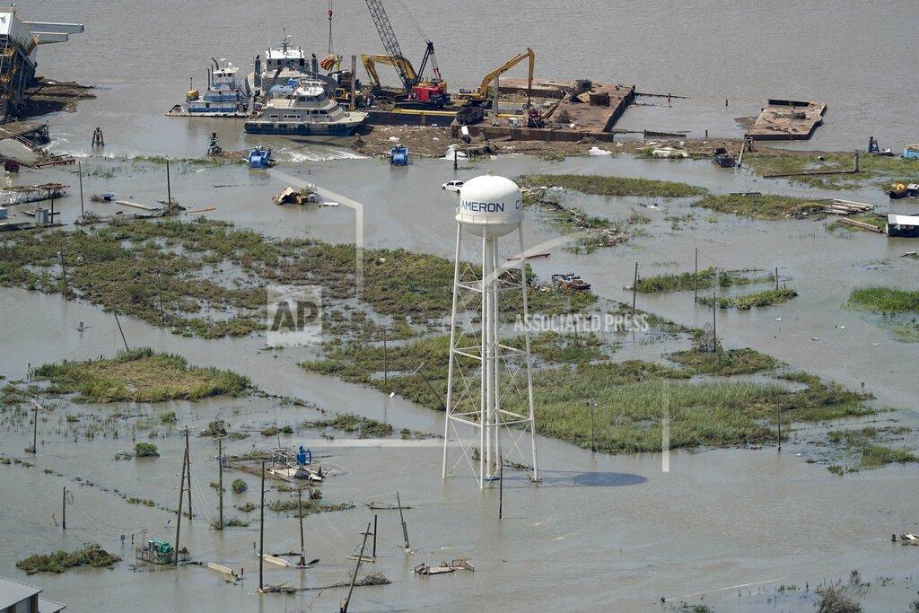 David J. Phillip Buildings are flooded in the aftermath of Hurricane Laura Thursday, Aug. 27, 2020, near Lake Charles, La. (AP Photo/David J. Phillip)