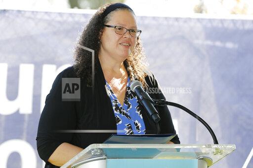 FILE - Annette Chambers-Smith, director of the Ohio Department of Rehabilitation and Correction, speaks during a groundbreaking celebration for the Alvis House expansion and renovation project Friday, Sept. 24, 2021, in Columbus, Ohio. The Ohio prisons system has announced its plan to deploy more than 5,000 body-worn cameras in all state prisons and adult parole authority offices. Chambers-Smith said Thursday, Jan. 13, 2022, the cameras are another tool for the agency to help protect both staff members and inmates. . (AP Photo/Jay LaPrete)