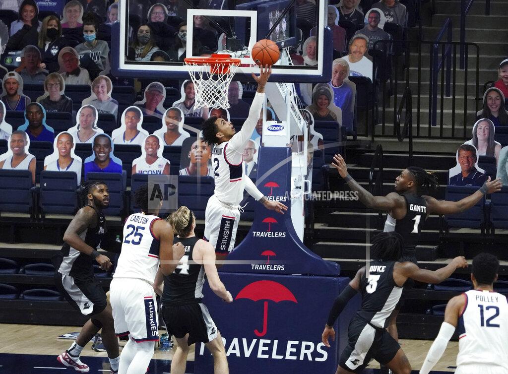 Connecticut guard James Bouknight (2) makes a basket against Providence during the second half of an NCAA college basketball game Tuesday, Feb. 16, 2021, in Storrs, Conn. (David Butler II/Pool Photo via AP)