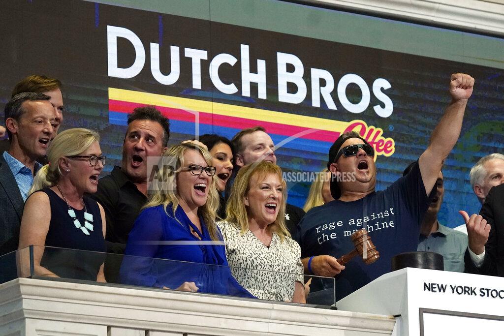 Richard Drew Dutch Bros Coffee Co-founder and Executive Chairman Travis Boersma, right, leads a chant before ringing the New York Stock Exchange closing bell, Wednesday, Sept. 15, 2021. (AP Photo/Richard Drew)