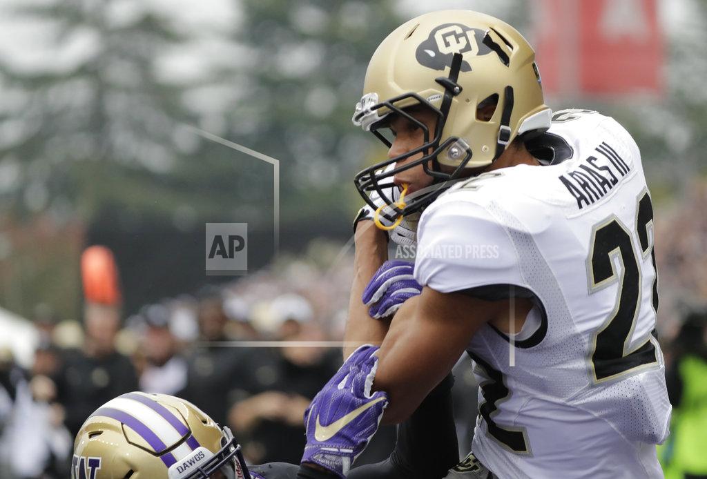 Ted S. Warren Colorado wide receiver Daniel Arias pulls down a pass for a touchdown during the first half of an NCAA college football game against Washington, Saturday, Oct. 20, 2018, in Seattle. (AP Photo/Ted S. Warren)