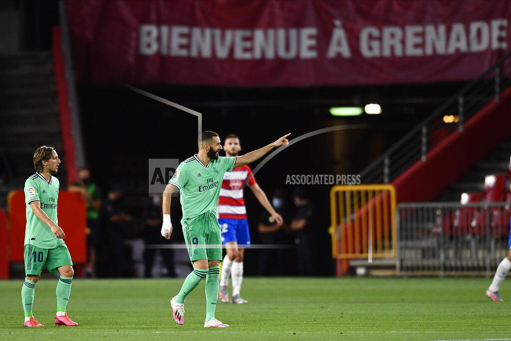 Jose Breton Real Madrid's Karim Benzema celebrates after scoring his side's second goal during the Spanish La Liga soccer match between Granada and Real Madrid at the Los Carmenes stadium in Granada, Spain, Monday, July 13, 2020. (AP Photo/Jose Breton)