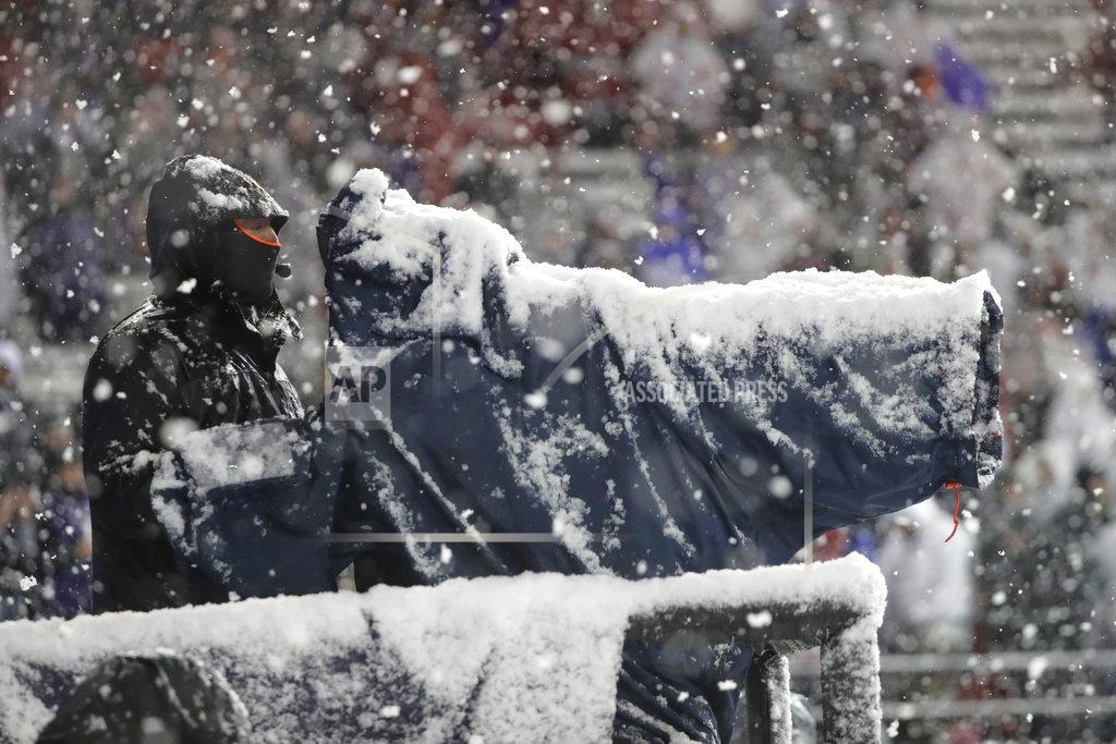 Ted S. Warren A television camera is covered in snow as the operator works during the second half of an NCAA college football game between Washington and Washington State, Friday, Nov. 23, 2018, in Pullman, Wash. Washington won 28-15. (AP Photo/Ted S. Warren)