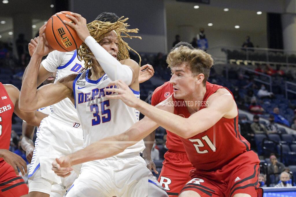 Mark Black DePaul's Brandon Johnson (35) secures the rebound against Rutgers' Dean Reiber (21) during the first half of an NCAA college basketball game Thursday, Nov. 18, 2021, in Chicago. (AP Photo/Mark Black)