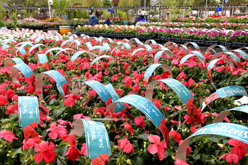 Nam Y. Huh Shoppers wear mask as they shop at a nursery & garden shop on Mother's Day weekend during COVID-19 pandemic in Wilmette, Ill., Saturday, May 8, 2021. (AP Photo/Nam Y. Huh)