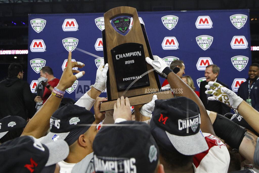 Carlos Osorio d FILE - In this Dec. 7, 2019, file photo, members of the Miami of Ohio team hold the champion trophy after the Mid-American Conference championship NCAA college football game against Central Michigan in Detroit. The Mid-American Conference announced Friday, Sept. 25, 2020, that it will have a 6-game football season, meaning all 10 major conferences will play this fall. (AP Photo/Carlos Osorio, File)