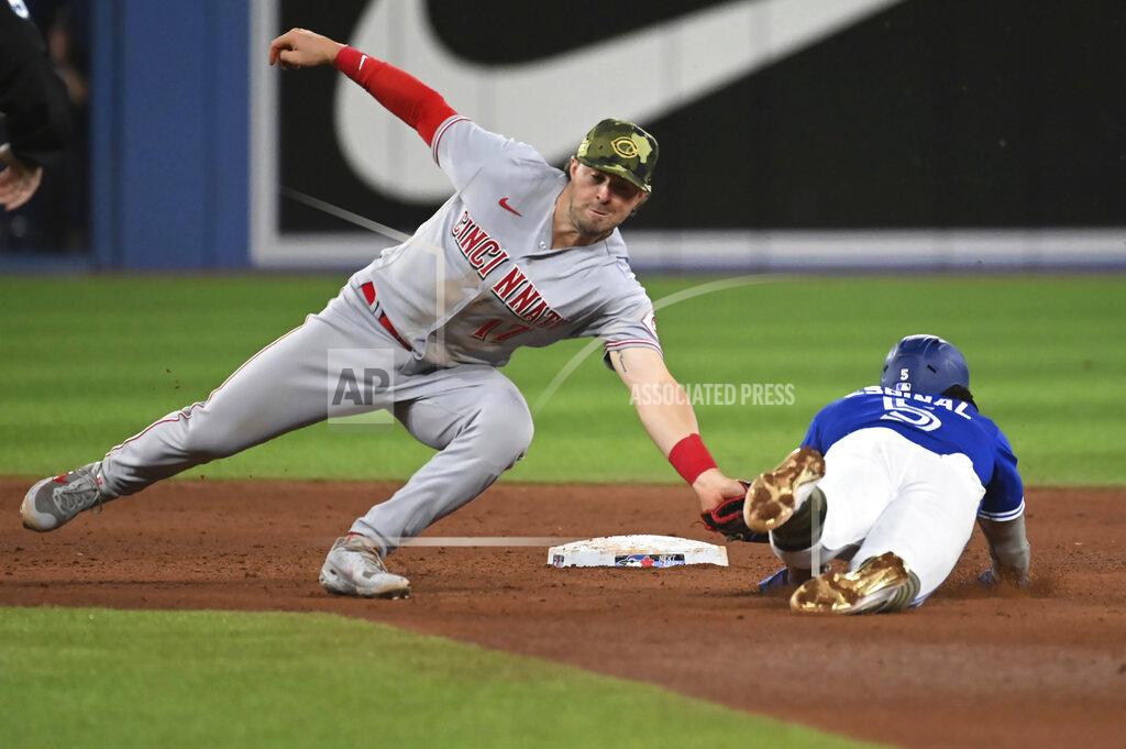 Jon Blacker Toronto Blue Jays' Santiago Espinal, right, is caught attempting to steal second base by Cincinnati Reds' Kyle Farmer during the eighth inning of a baseball game Friday, May 20, 2022, in Toronto. (Jon Blacker/The Canadian Press via AP)