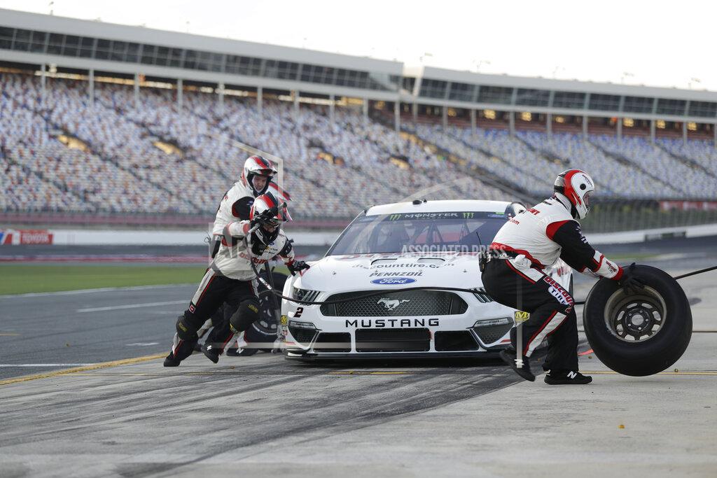 Chuck Burton Crew members perform a pit stop on driver Brad Keselowski's car during qualifying for Saturday's NASCAR All-Star Cup series auto race at Charlotte Motor Speedway in Concord, N.C., Friday, May 17, 2019. (AP Photo/Chuck Burton)