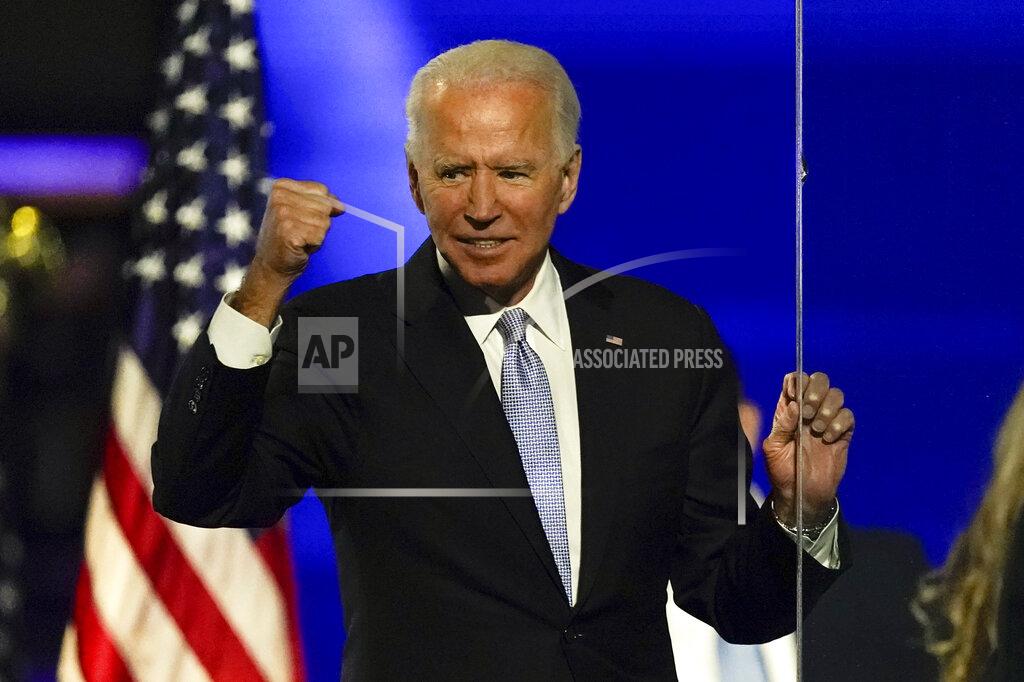 Andrew Harnik President-elect Joe Biden gestures to supporters Saturday, Nov. 7, 2020, in Wilmington, Del. (AP Photo/Andrew Harnik)