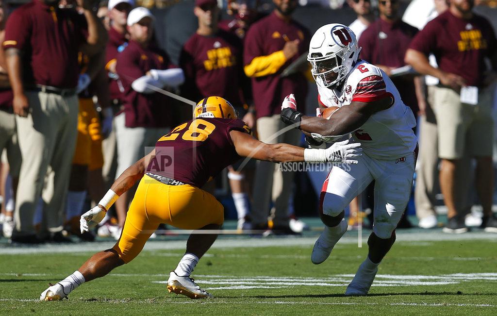 Rick Scuteri Utah running back Zack Moss (2) avoids a tackle by Arizona State defensive back Demonte King in the first half during an NCAA college football game, Saturday, Nov. 3, 2018, in Tempe, Ariz. (AP Photo/Rick Scuteri)