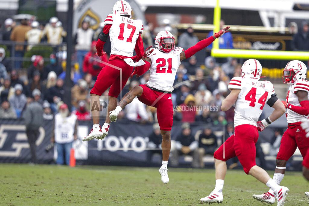 Michael Conroy Nebraska cornerback Lamar Jackson (21) celebrates an interception with cornerback Braxton Clark (17) during the first half of an NCAA college football game against Purdue in West Lafayette, Ind., Saturday, Nov. 2, 2019. (AP Photo/Michael Conroy)