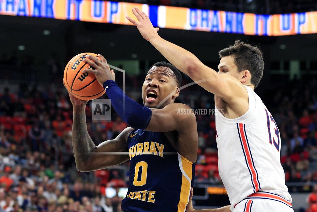 Butch Dill Murray State forward KJ Williams (0) goes up for a shot as Auburn forward Walker Kessler (13) defends during the first half of an NCAA college basketball game Wednesday, Dec. 22, 2021 in Auburn, Ala. (AP Photo/Butch Dill)