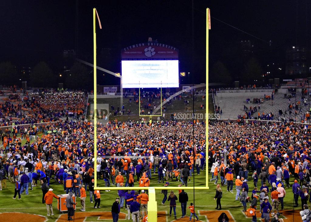 Richard Shiro Clemson fans rush the field after the team's NCAA college football game against Duke on Saturday, Nov. 17, 2018, in Clemson, S.C. Clemson won 35-6. (AP Photo/Richard Shiro)