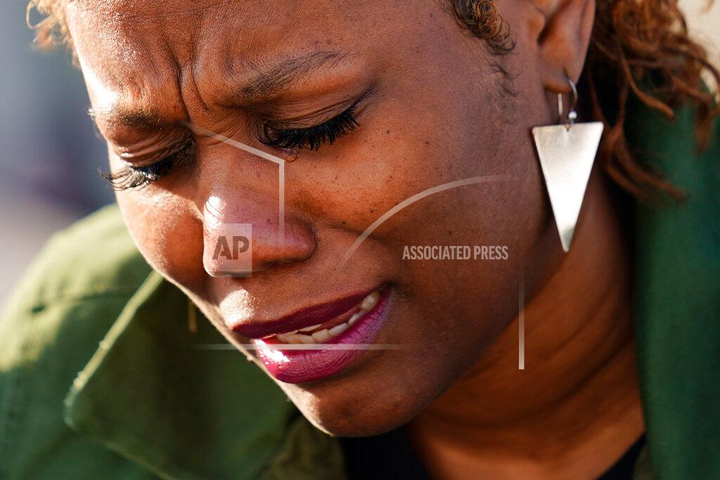 Matt Rourke Tears form in Stephanie Dixon's eyes as she prays at the scene of Saturday's shooting at a supermarket, in Buffalo, Thursday, May 19, 2022. (AP Photo/Matt Rourke)