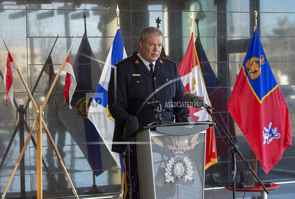 Andrew Vaughan Royal Canadian Mounted Police Chief Superintendent Chris Leather fields questions at a news conference at RCMP headquarters in Dartmouth, Nova Scotia, Sunday, April 19, 2020. Canadian police say multiple people are dead plus the suspect after a shooting rampage across the province of Nova Scotia. It was the deadliest shooting in Canada in 30 years. (Andrew Vaughan/The Canadian Press via AP)