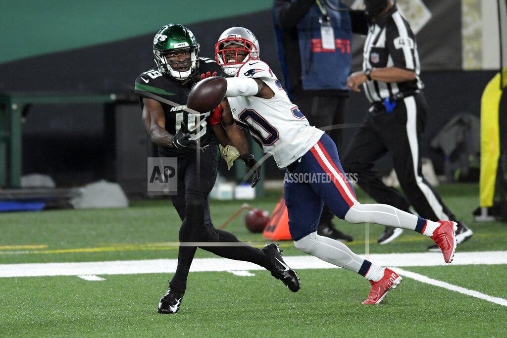 Bill Kostroun New England Patriots' Jason McCourty, right, is called for pass interference while defending against New York Jets' Breshad Perriman during the first half of an NFL football game, Monday, Nov. 9, 2020, in East Rutherford, N.J. (AP Photo/Bill Kostroun)