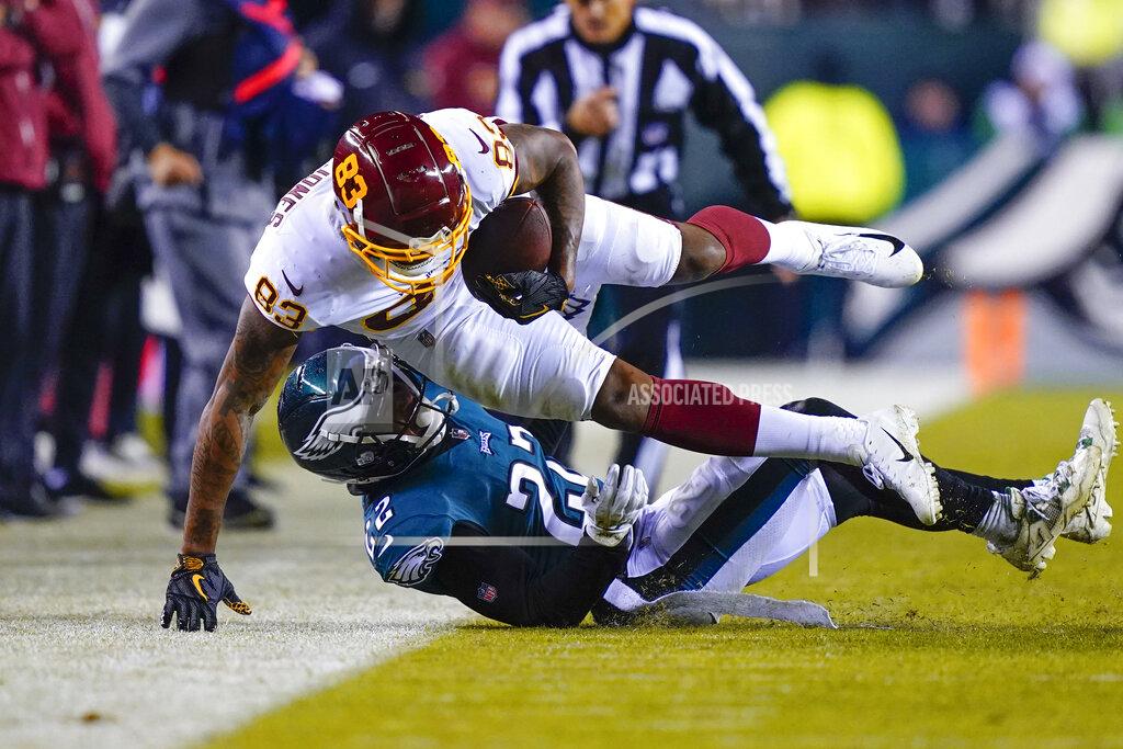 Matt Rourke Philadelphia Eagles' Marcus Epps, bottom, tackles Washington Football Team's Ricky Seals-Jones during the second half of an NFL football game, Tuesday, Dec. 21, 2021, in Philadelphia. (AP Photo/Matt Rourke)