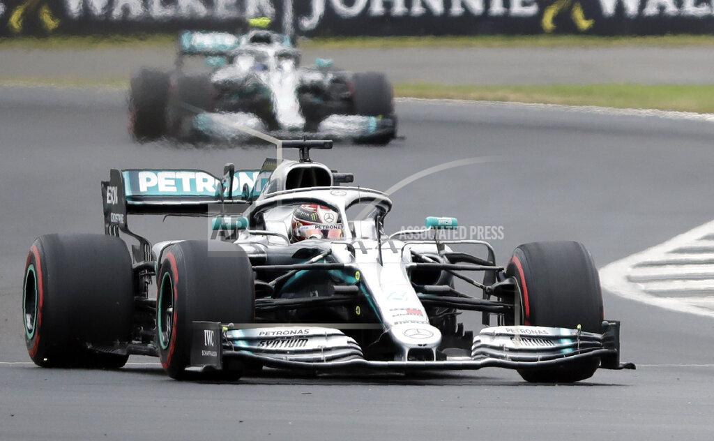 Luca Bruno Mercedes driver Lewis Hamilton of Britain steers his car followed by Mercedes driver Valtteri Bottas of Finland during the third free practice at the Silverstone racetrack, in Silverstone, England, Saturday, July 13, 2019. The British Formula One Grand Prix will be held on Sunday. (AP Photo/Luca Bruno)