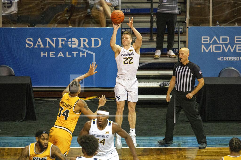Josh Jurgens West Virginia guard Sean McNeil (22) shoots a three-point basket during the first half of an NCAA college basketball game against VCU, Thursday, Nov. 26, 2020, in SIoux Falls, S.D. (AP Photo/Josh Jurgens)