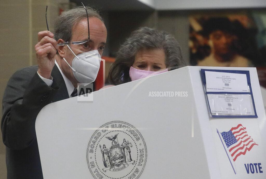 Bebeto Matthews Pat Ennis Engel, right, stands with her husband Congressman Eliot Engel as he prepares to cast votes for primary elections Tuesday June 23, 2020, in the Riverdale section of New York. Engel is being challenged by former middle school principal Jamaal Bowman. (AP Photo/Bebeto Matthews)