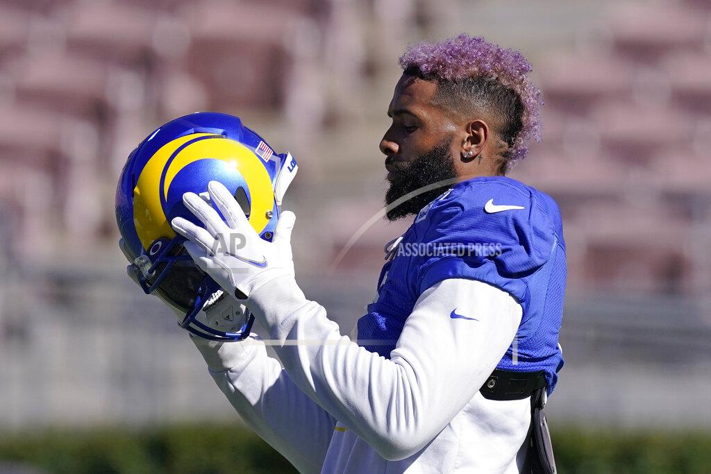 Mark J. Terrill Los Angeles Rams wide receiver Odell Beckham Jr. puts on his helmet during practice for an NFL Super Bowl football game Thursday, Feb. 10, 2022, in Pasadena, Calif. The Rams are scheduled to play the Cincinnati Bengals in the Super Bowl on Sunday. (AP Photo/Mark J. Terrill)