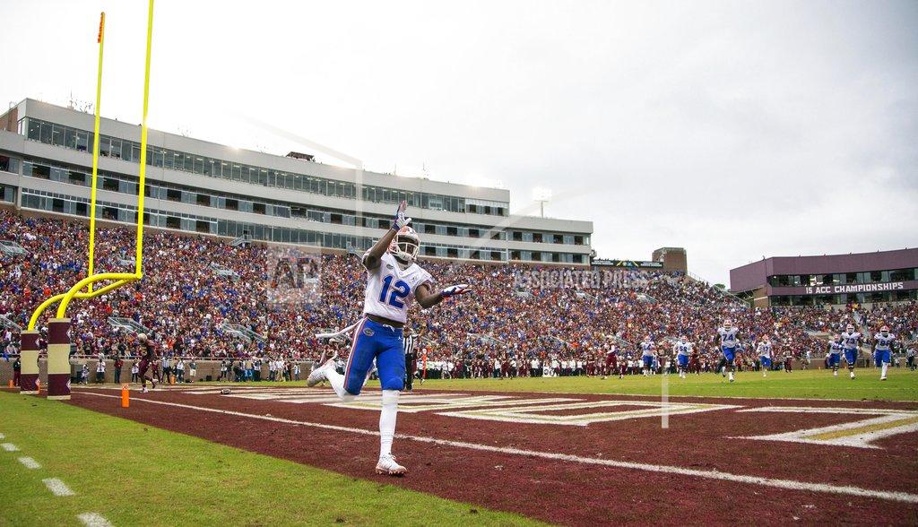 Mark Wallheiser Florida wide receiver Van Jefferson (12) does the gator chomp after making a 38 yard touchdown catch in the 2nd half of an NCAA college football game against Florida State in Tallahassee, Fla., Saturday, Nov. 24, 2018. Florida defeated Florida State 41-14. (AP Photo/Mark Wallheiser)