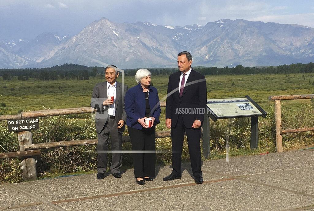 Martin Crutsinger FILE - In this Aug. 25, 2017 file photo, Federal Reserve Chair Janet Yellen, center, talks with Mario Draghi, right, head of the European Central Bank, and Haruhiko Kuroda, head of the Bank of Japan, during a break at the central bankers conference at Jackson Hole, Wyo. Italy's weary president on Wednesday, Feb. 3, 2021 tapped "Super Mario," arguably the world's most famous Italian, to resolve a festering political crisis that threatens the ability of the eurozone's third-largest economy to manage the coronavirus pandemic and recover from the worst recession since World War II. (AP Photo/Martin Crutsinger, File)