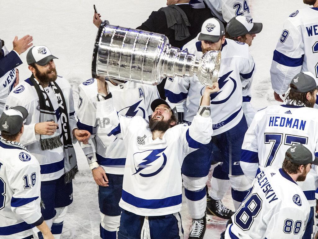 Jason Franson FILE - In this Sept. 28, 2020, file photo, Tampa Bay Lightning's Nikita Kucherov (86) hoists the Stanley Cup after defeating the Dallas Stars in the NHL Stanley Cup hockey finals in Edmonton, Alberta. Kucherov is expected to miss the entire regular season because of a hip injury that requires surgery. General manager Julien BriseBois ruled out Kucherov for the 56-game season that begins Jan. 13 and ends May 8. (Jason Franson/The Canadian Press via AP, File)
