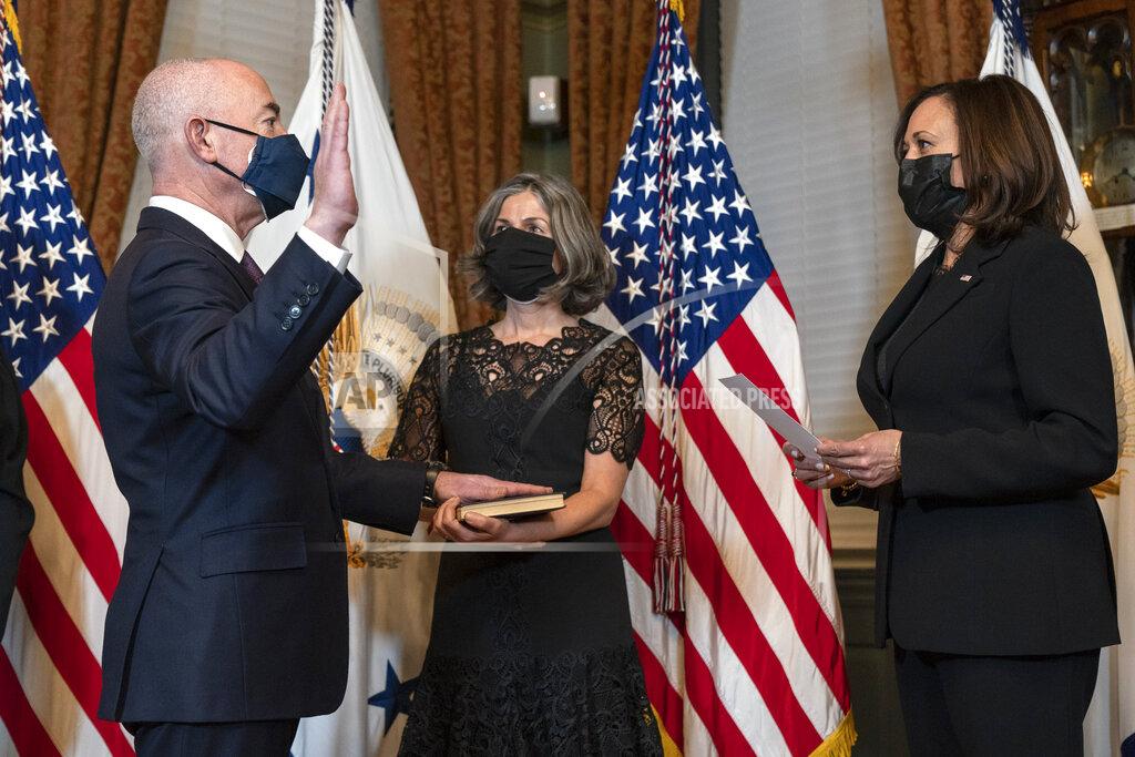 Jacquelyn Martin Vice President Kamala Harris, right, ceremonially swears in Alejandro Mayorkas as Secretary of the Department of Homeland Security, accompanied by his wife Tanya Mayorkas, Tuesday, Feb. 2, 2021, at the Eisenhower Executive Office Building on the White House Complex in Washington. (AP Photo/Jacquelyn Martin)
