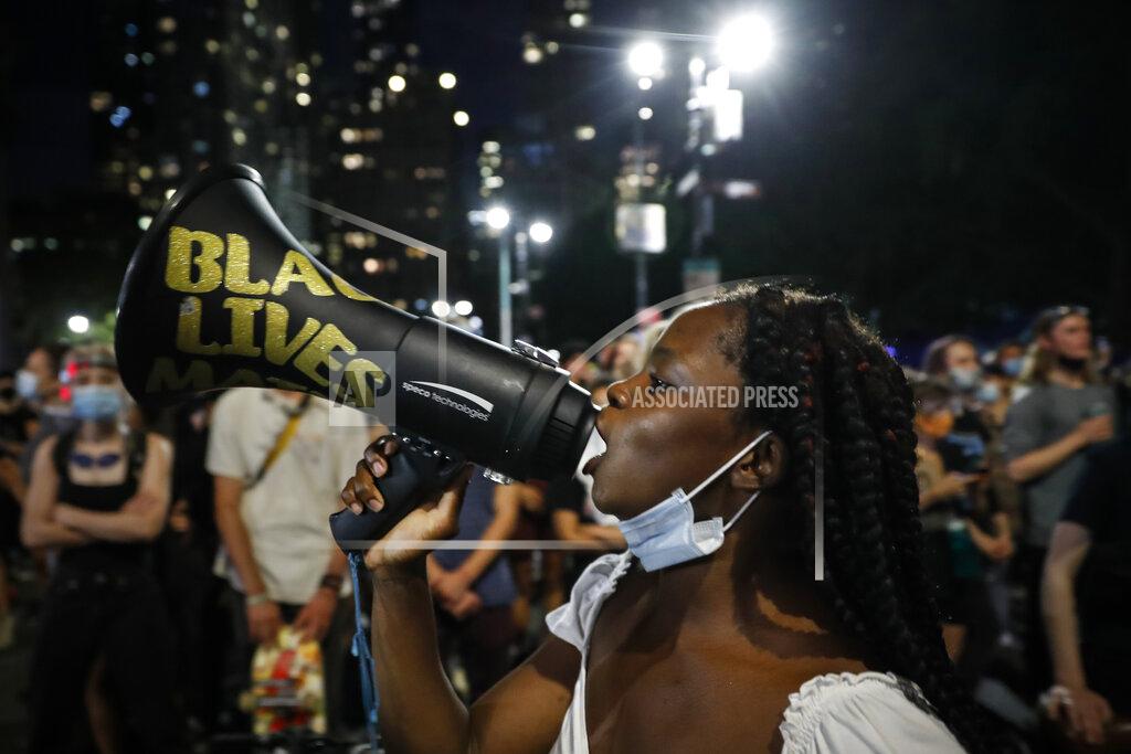 John Minchillo FILE - In this June 30, 2020, file photo, protesters gather at an encampment outside City Hall in New York. As protesters filled America's streets in the summer of 2020 demanding justice after George Floyd’s murder by police, corporations and major philanthropists pledged an outpouring of donations for racial equity causes. A year later, racial justice retains its high profile across the country, but advocates so far see little systemic progress. (AP Photo/John Minchillo, File)